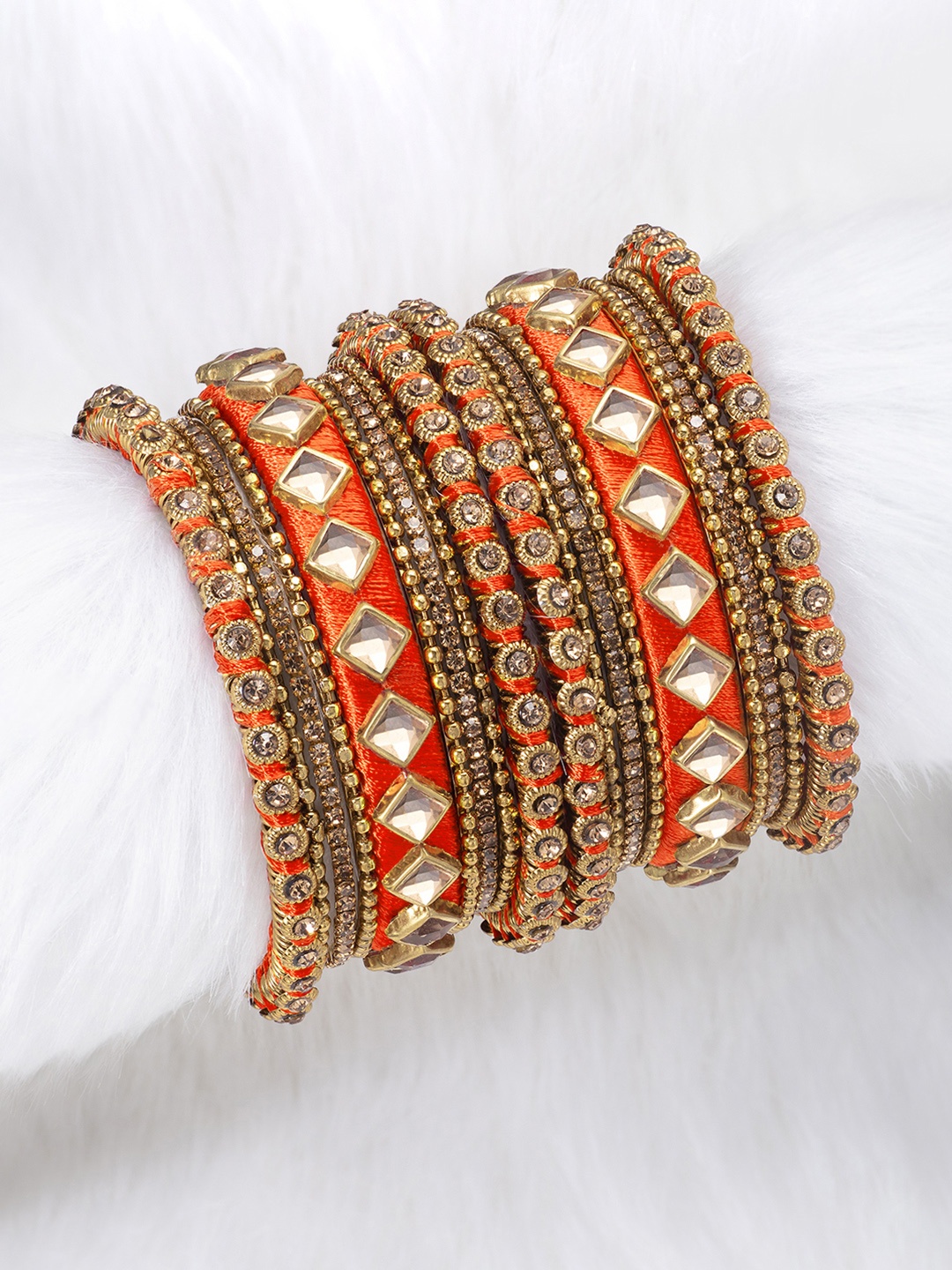 

Peora Set of 18 Orange Handcrafted Silk Thread Kundan Chuda Bangles