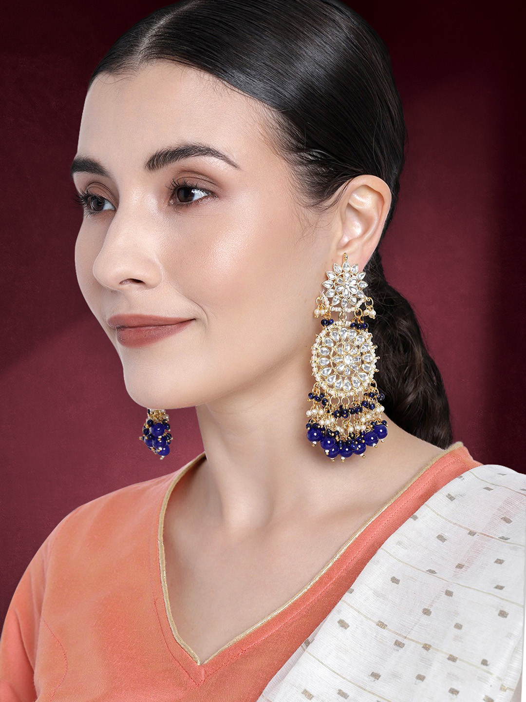 

Peora Blue & White Gold Plated Crescent Shaped Floral Tassel Drop Earrings