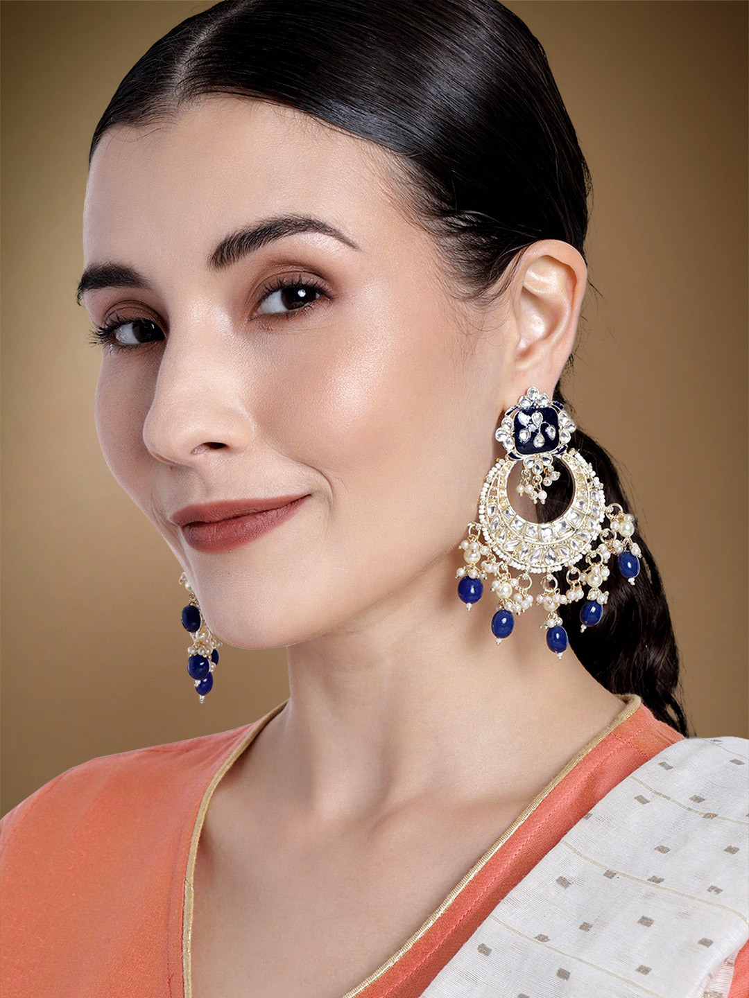 

Peora Blue & White Gold Plated Crescent Shaped Meena Work Hand Made Kundan Chandbalis