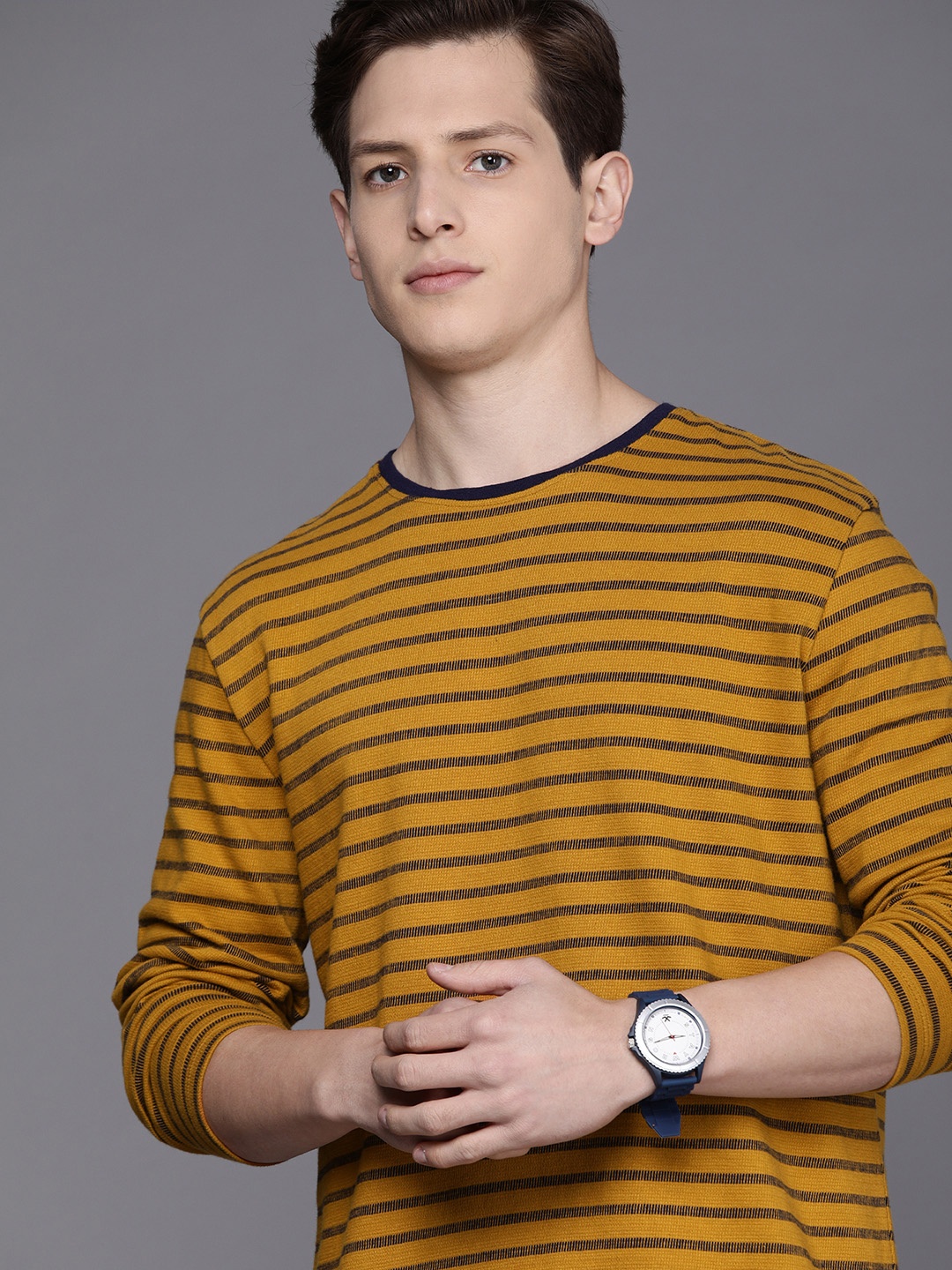 

Voi Jeans Men Mustard Yellow & Navy Blue Striped T-shirt