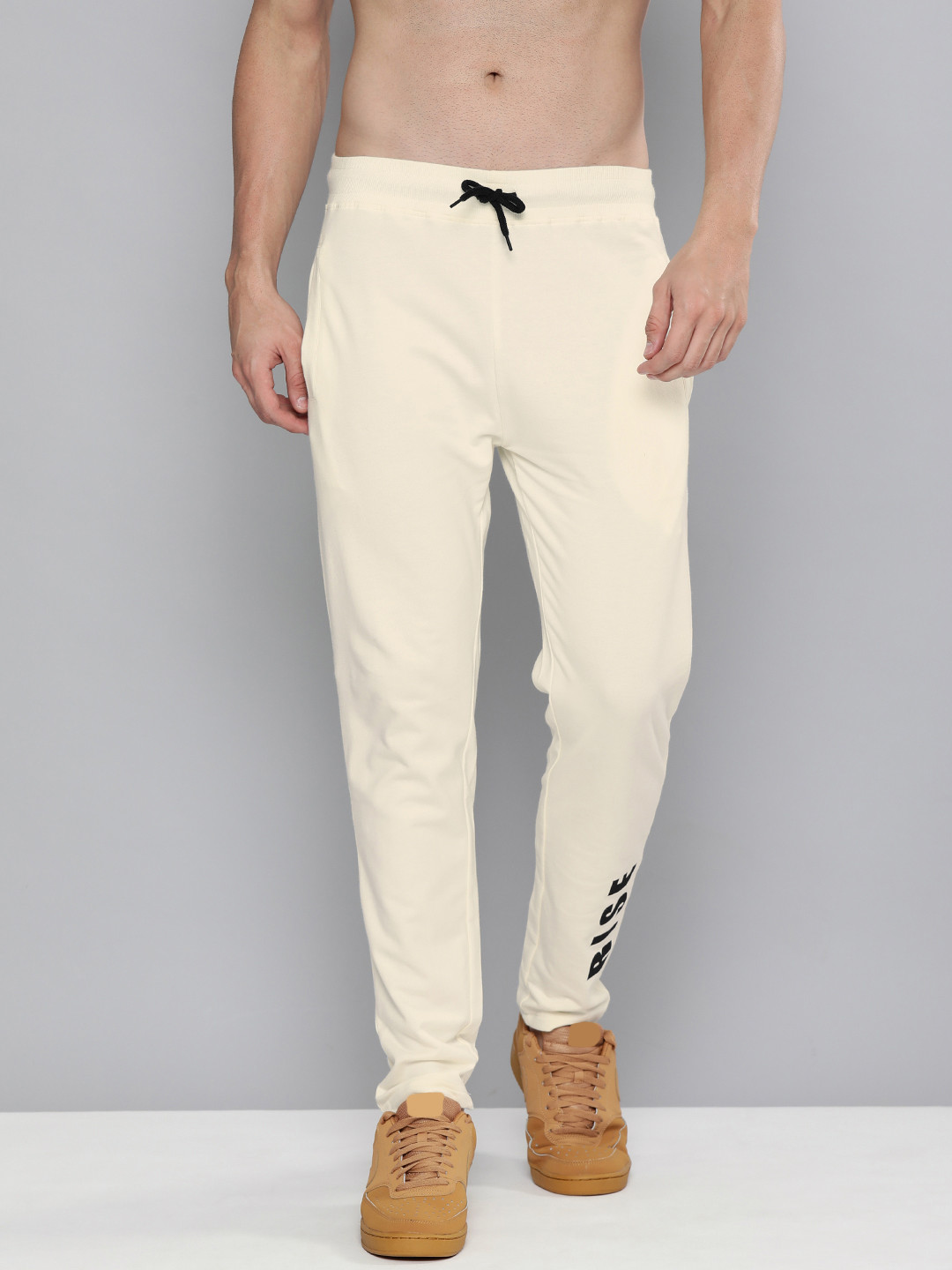 

HERE&NOW Men Cream Typography Printed Pure Cotton Regular Track Pants