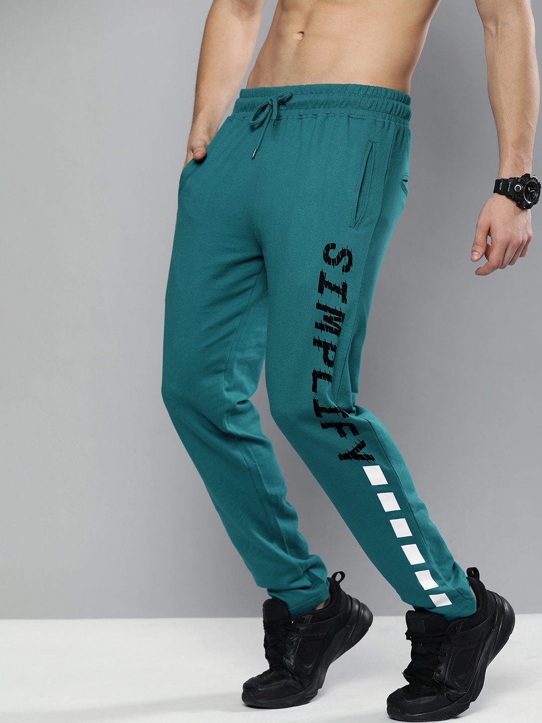 

HERE&NOW Men Teal & Black Printed Track Pants
