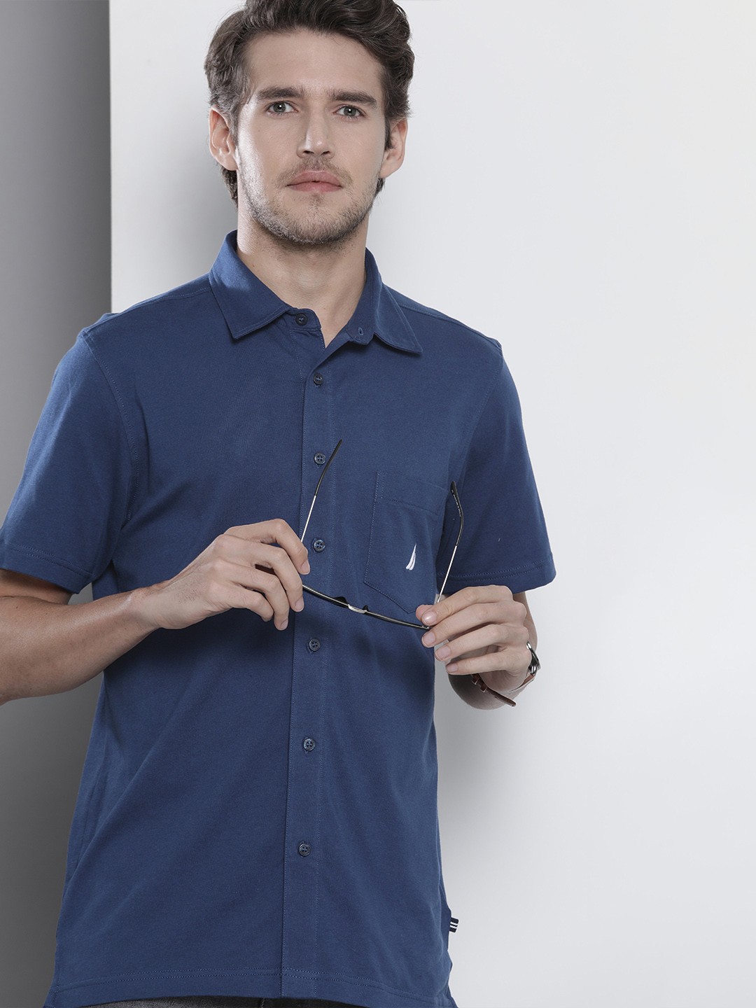 

Nautica Men Navy Blue Solid Regular Fit Casual Shirt With A Patch Pocket