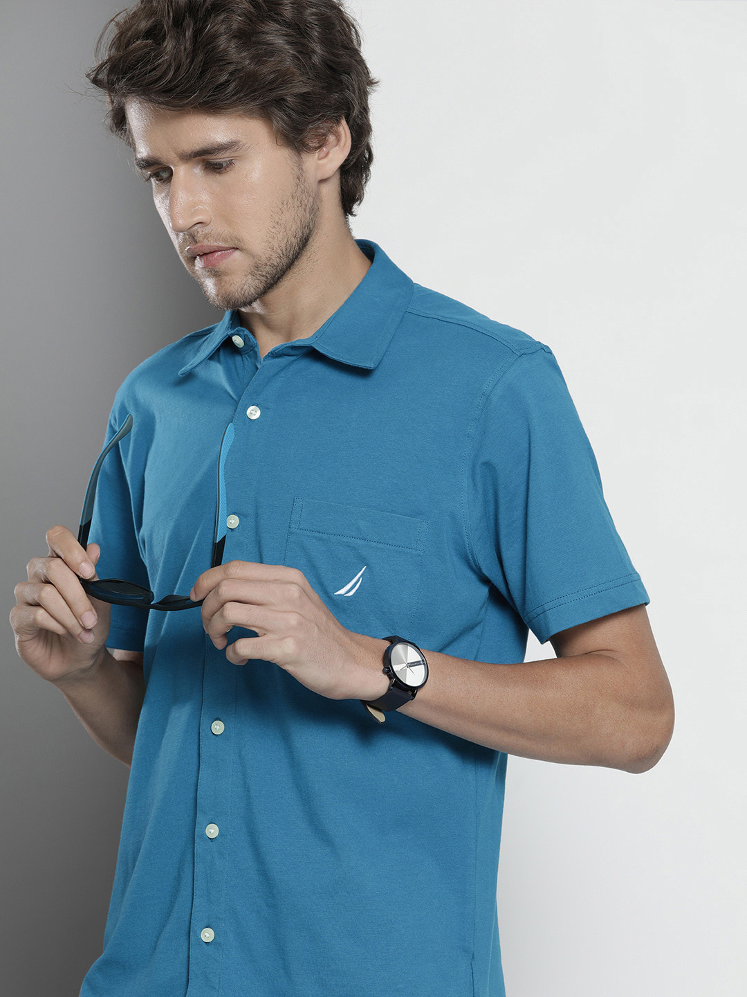 

Nautica Men Blue Regular Fit Solid Polo Collar Casual Shirt