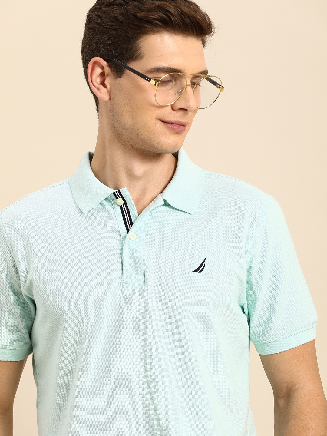 

Nautica Men Blue Solid Polo Collar T-shirt