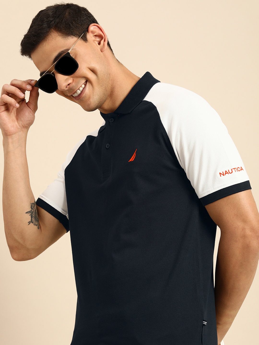 

Nautica Men Navy Blue & White Solid Raglan Sleeves Polo Collar T-shirt