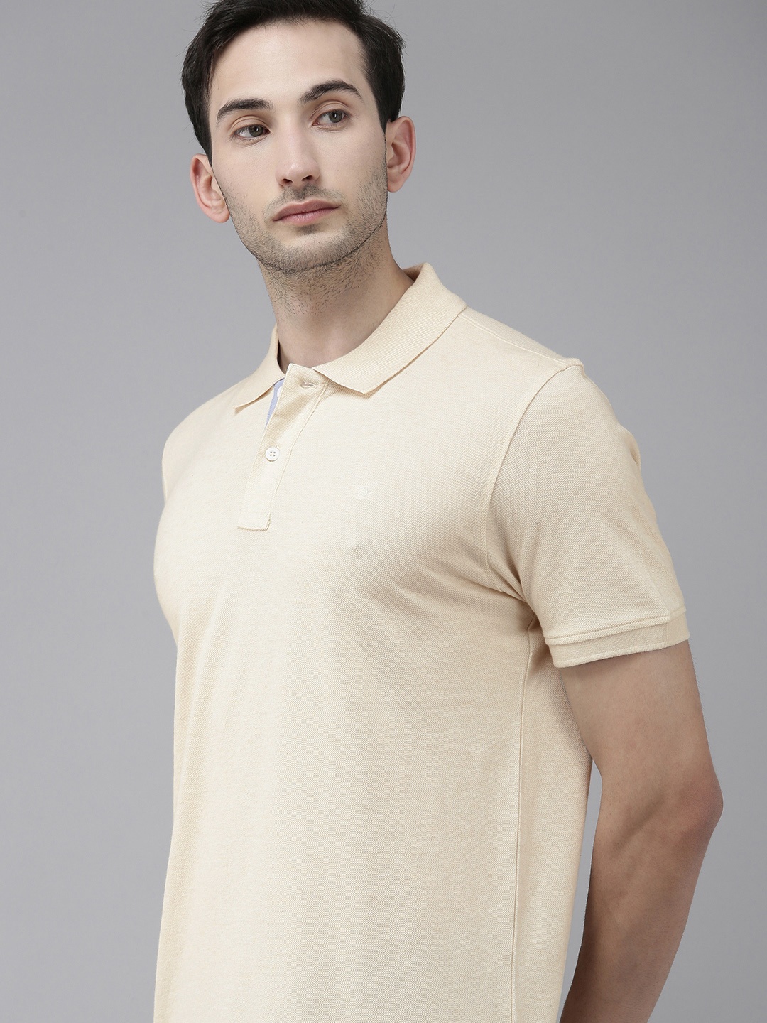 

Arrow Sport Men Off White Solid Polo Collar T-shirt