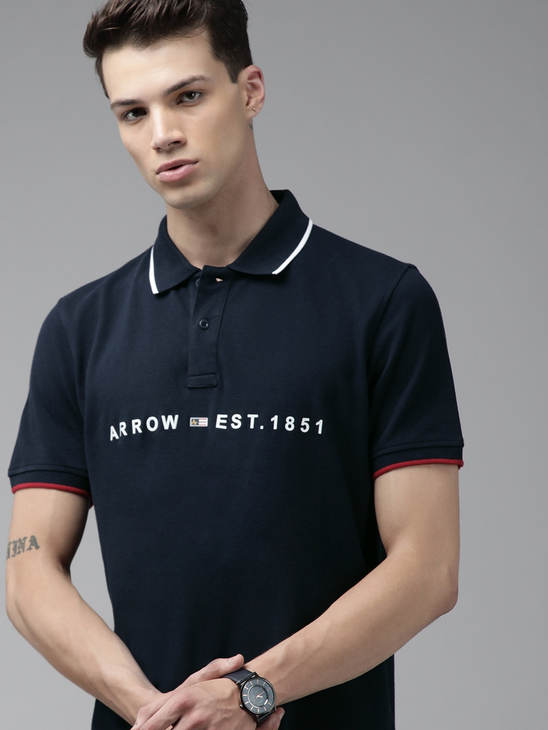 

Arrow Sport Men Blue Typography Printed Polo Collar Pure Cotton T-shirt