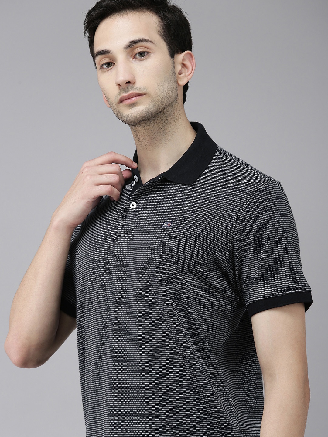 

Arrow Sport Men Black & White Striped Polo Collar T-shirt