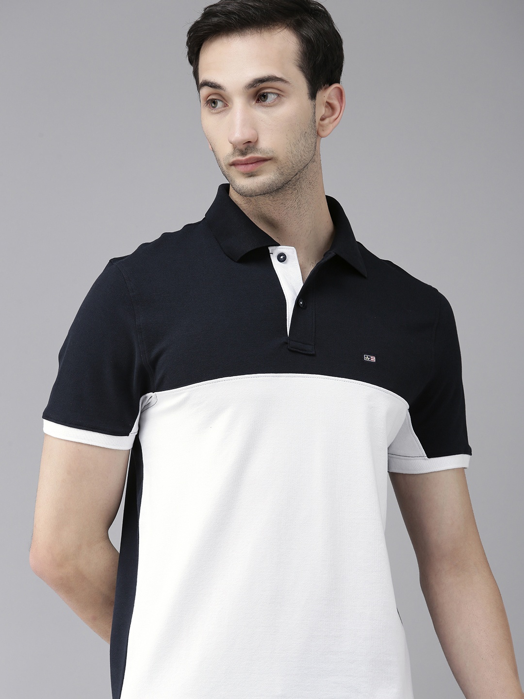 

Arrow Sport Men White & Navy Blue Colourblocked Polo Collar T-shirt