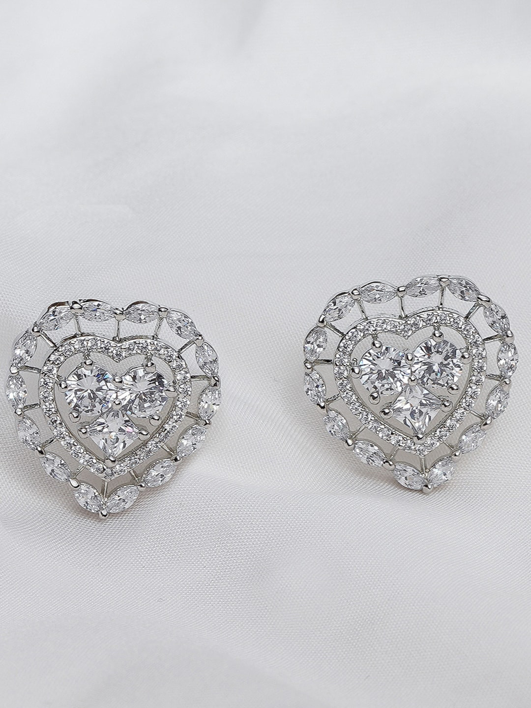 

Queen Be Silver-Toned Stone Studded Heart Shaped Studs Earrings