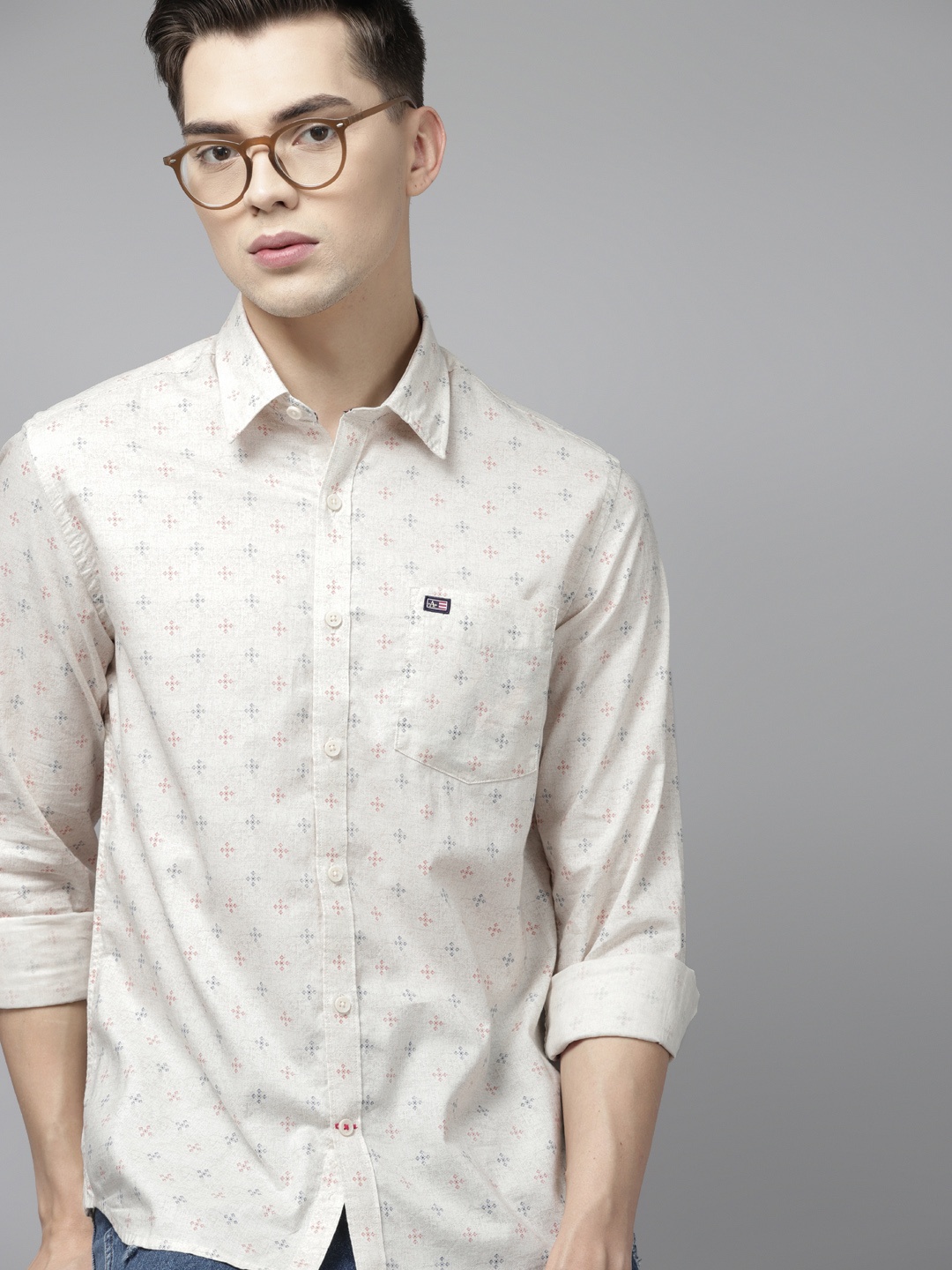 

Arrow Men Beige & Red Cotton Abstract Print Slim Fit Printed Casual Shirt