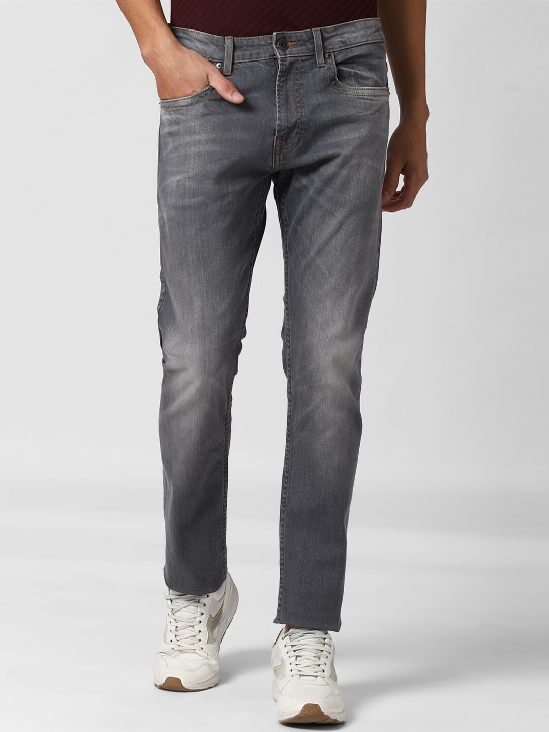 

Peter England Casuals Men Grey Tapered Fit Low Distress Heavy Fade Jeans