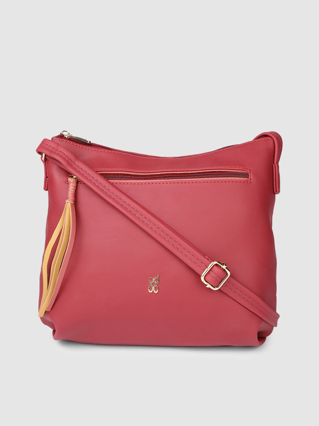

Baggit Red Solid Synthetic Regular Structured Sling Bag with Tasselled Detail
