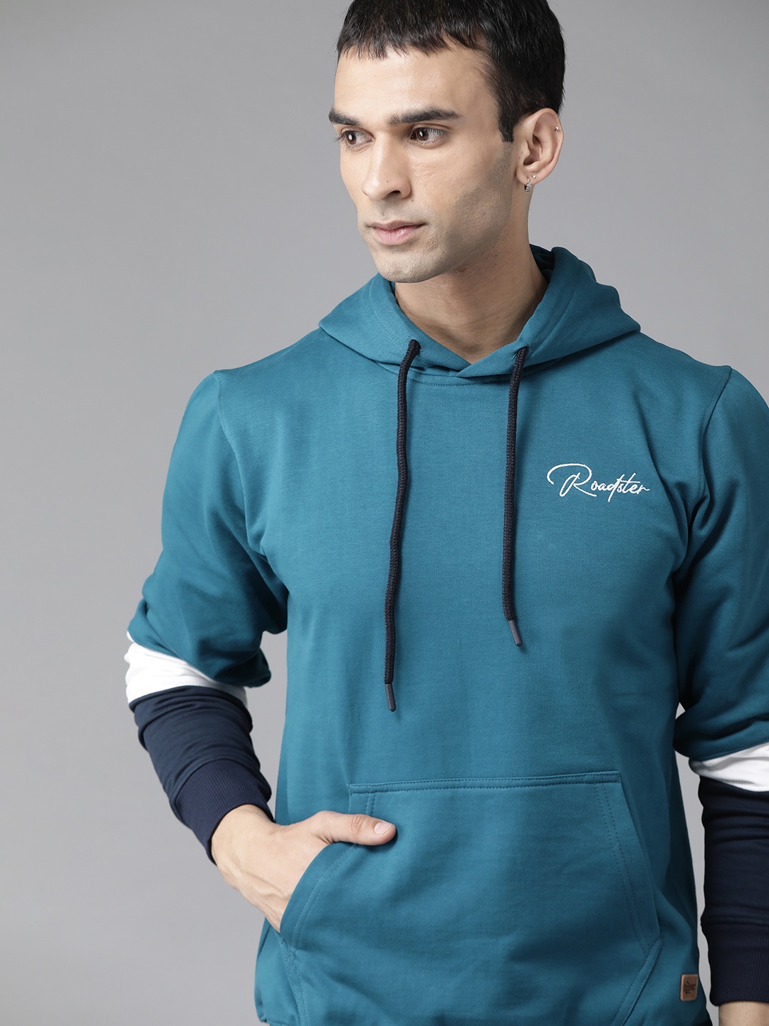 

The Roadster Lifestyle Co Men Teal Blue Solid Hooded Sweatshirt