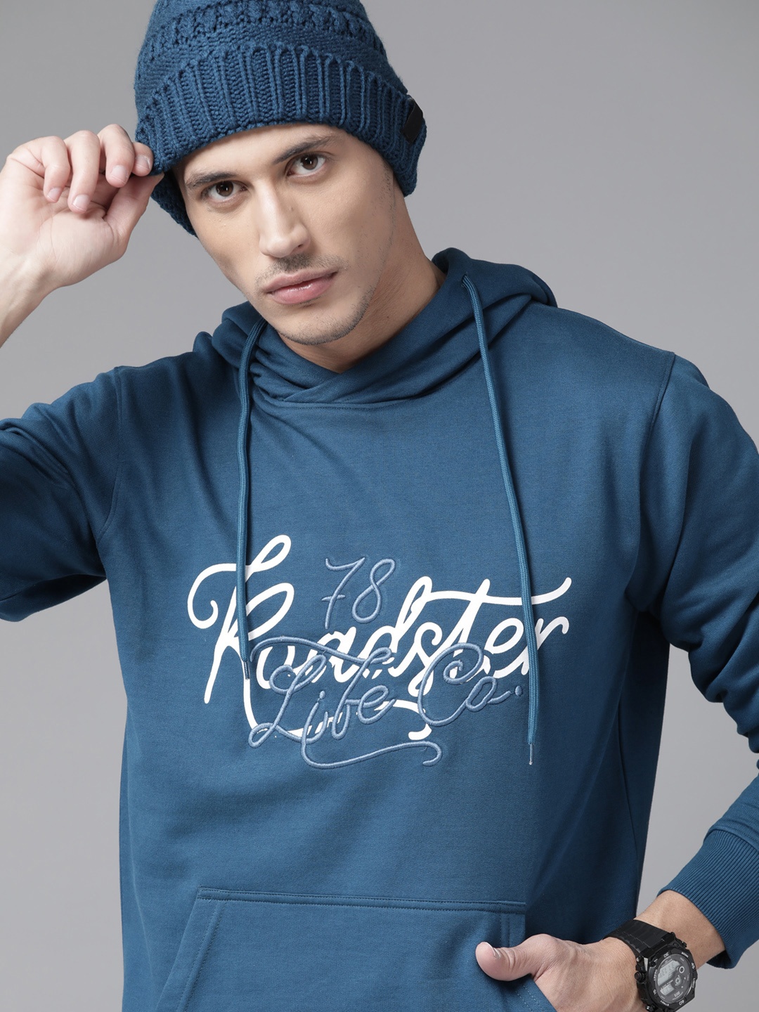 

The Roadster Lifestyle Co Men Teal Blue & White Printed Hooded Sweatshirt