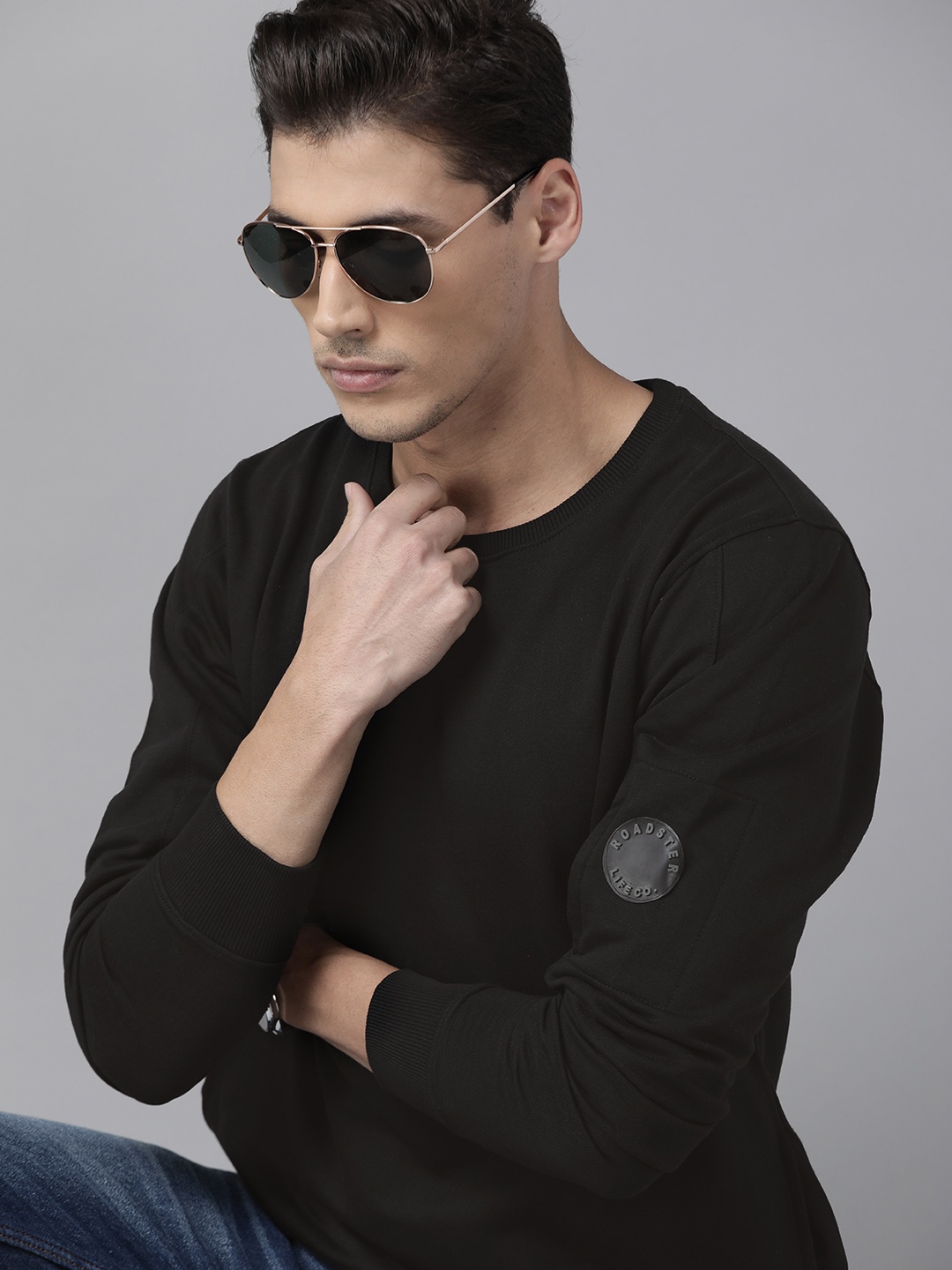 

The Roadster Lifestyle Co Men Black Solid Sweatshirt
