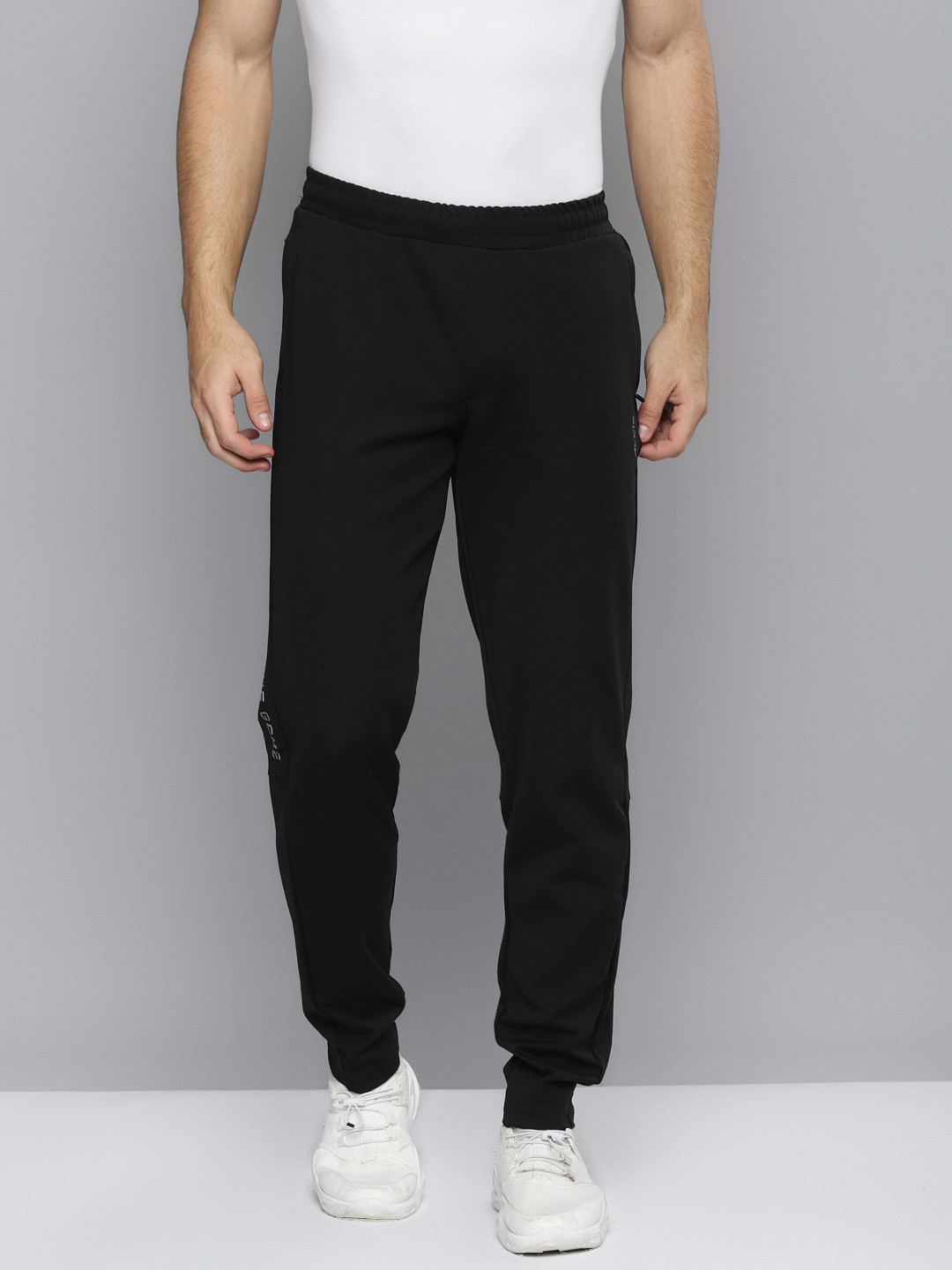 

Alcis Men Black Solid Slim Fit Mid-Rise Track Pants