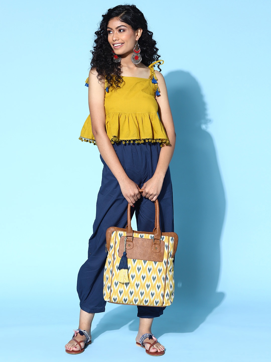 

Sangria Yellow & Green Ikat Printed Shoulder Bag with Tasselled