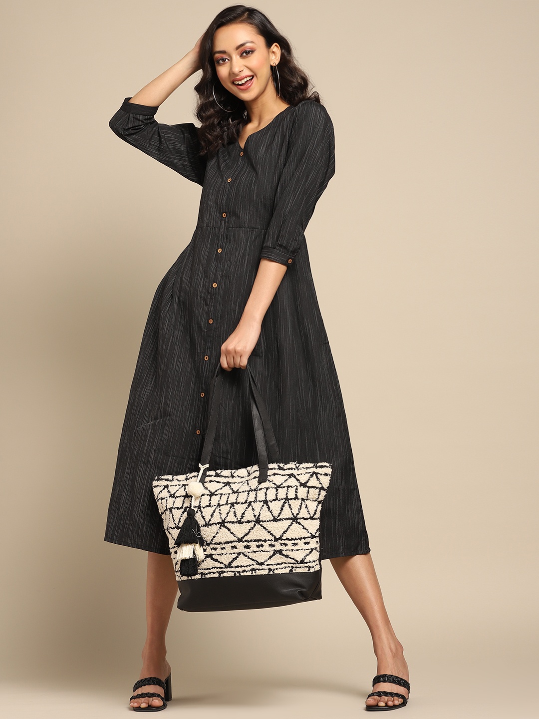 

Anouk Off White & Black Jacquard Woven Design Shoulder Bag with Tasselled