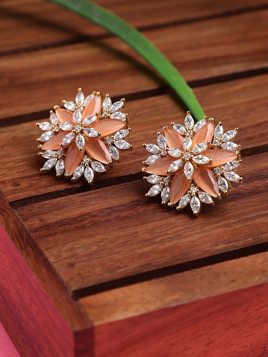 

Adwitiya Collection Gold-Toned & Peach-Coloured Floral Studs Earrings