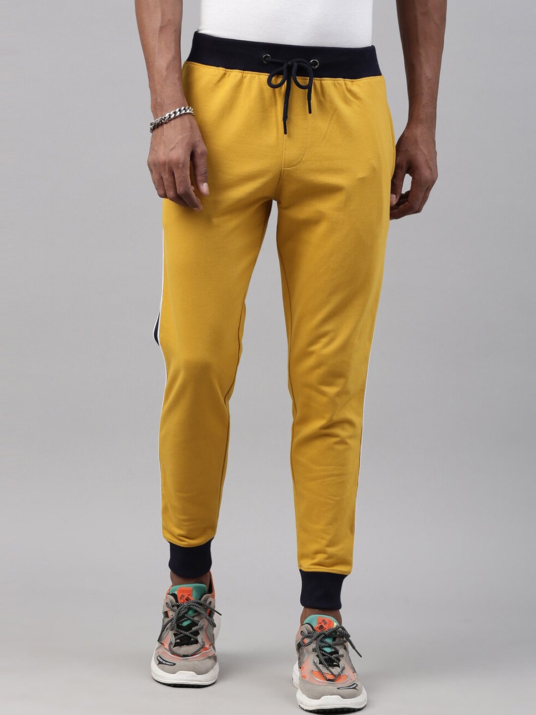 

Breakbounce Men Mustard Yellow & Black Solid Joggers