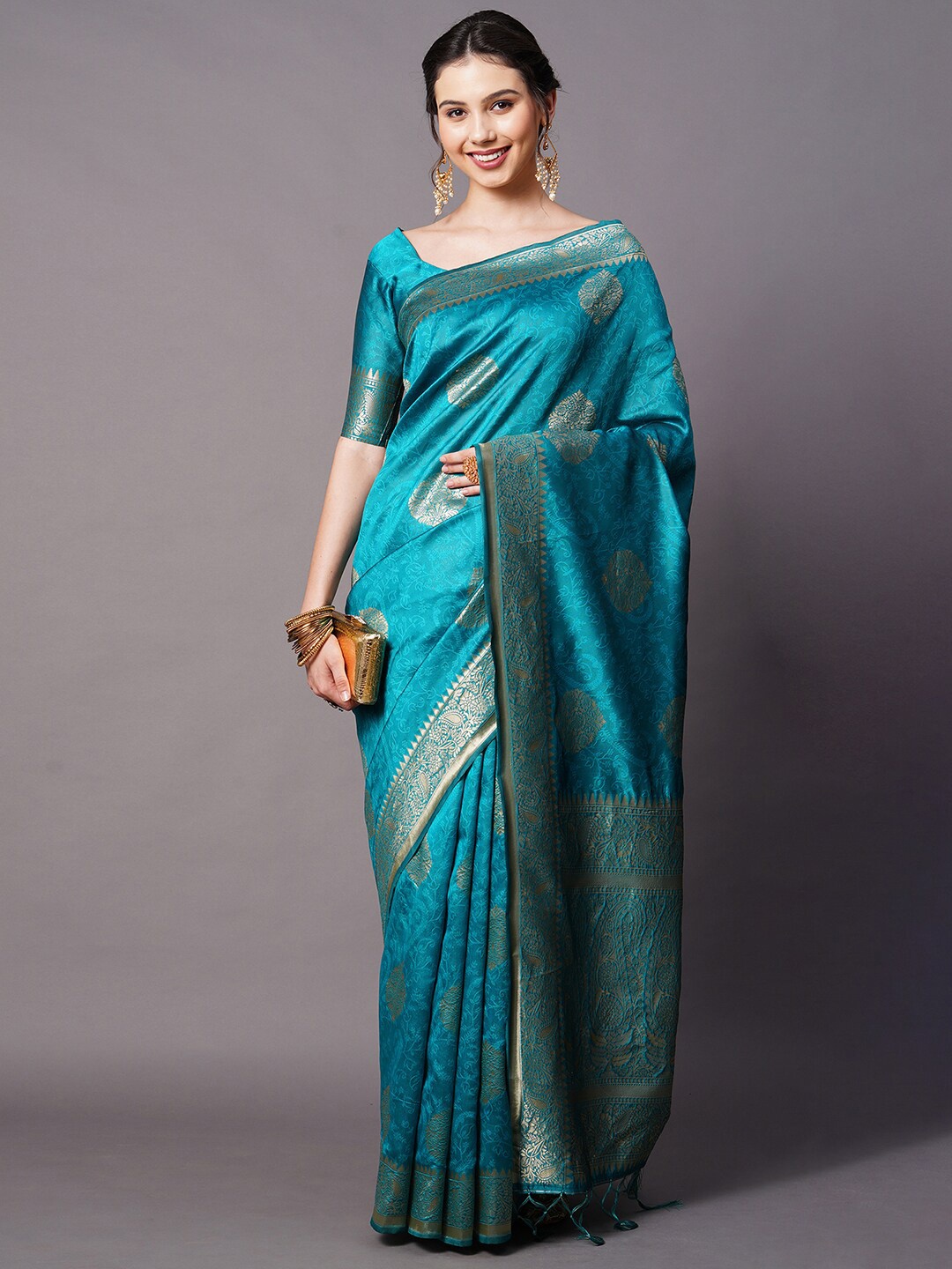 

Mitera Women Teal Woven Silk Blend Saree