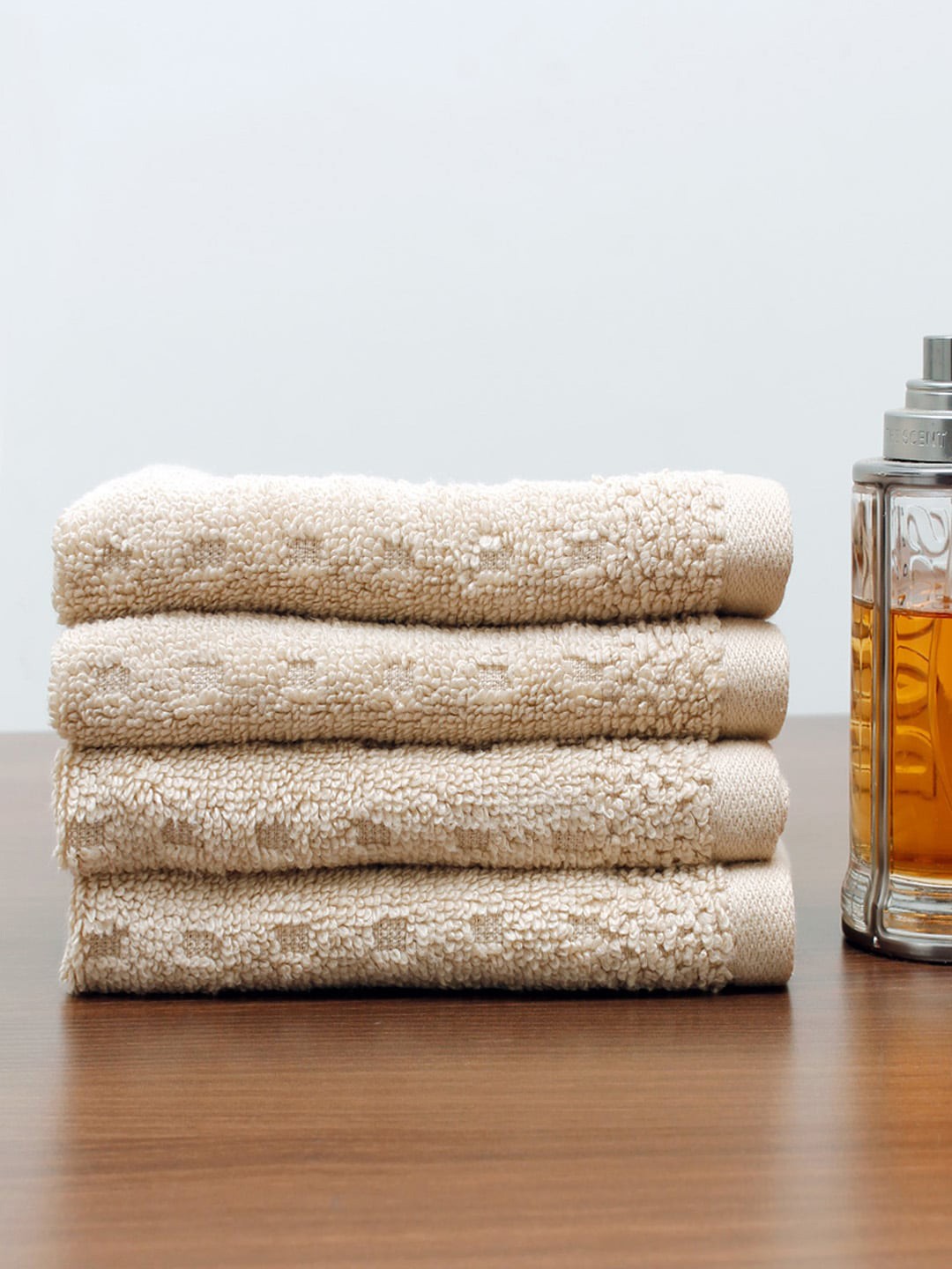 

AVI Living Set of 4 Beige Solid 550 GSM Pure Cotton Face Towels
