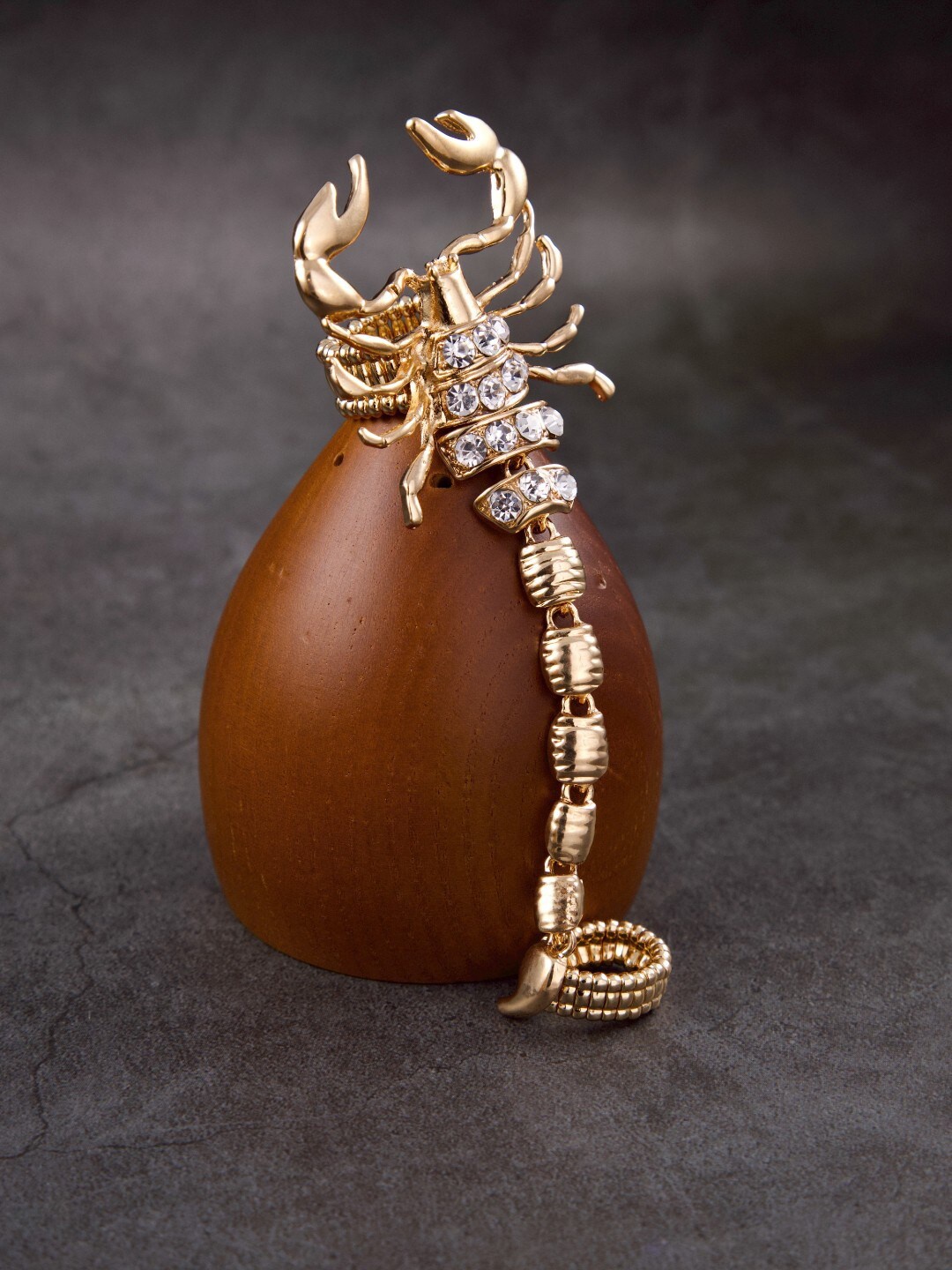 

anore Gold-Plated & White Stone Studded Scorpion Finger Ring