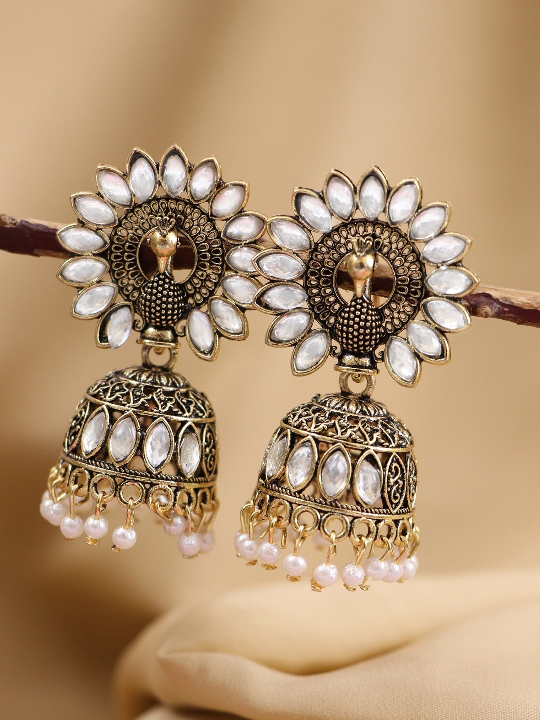 

Crunchy Fashion White & Gold-Toned Peacock Shaped Jhumkas Earrings