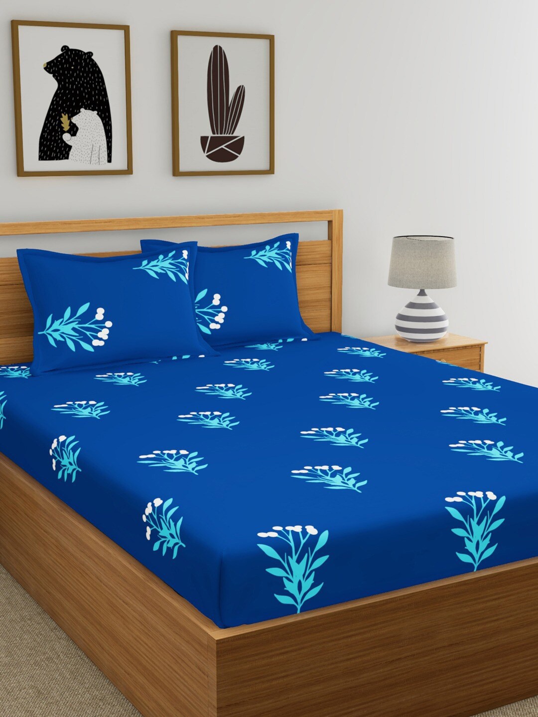 

Home Ecstasy Blue & White Floral 140 TC King Cotton Bedsheet with 2 Pillow Covers