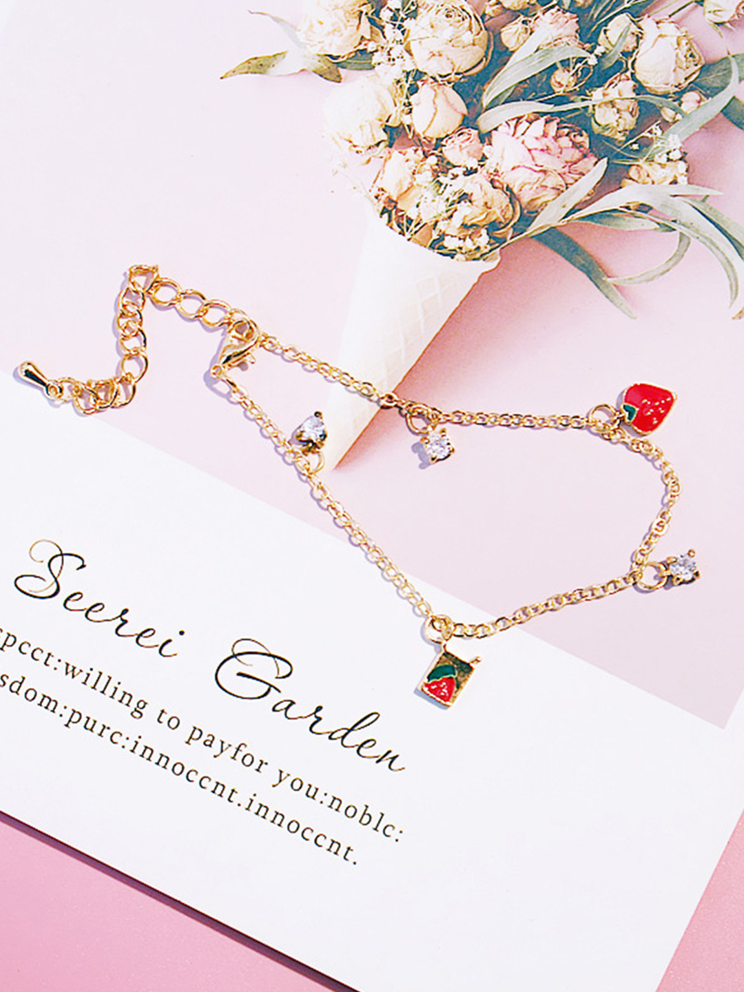 

URBANIC Women Gold-Toned & Red Stone Studded Enamelled Charm Bracelet