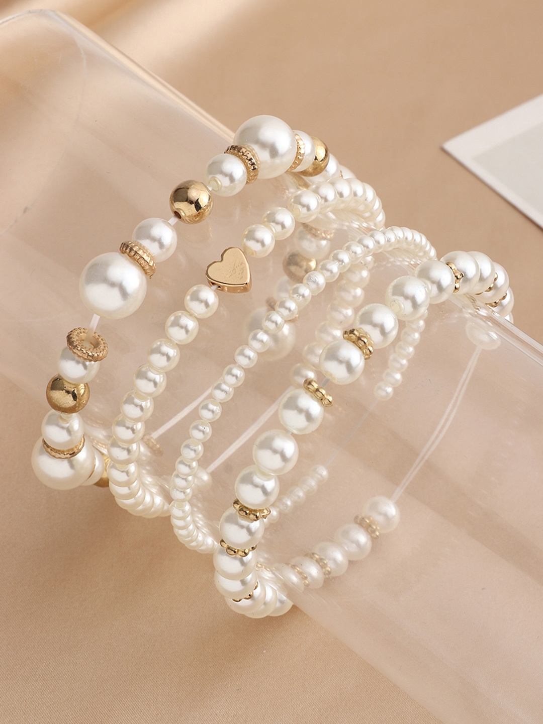 

URBANIC Women Set of 4 White & Gold-Toned Bracelets