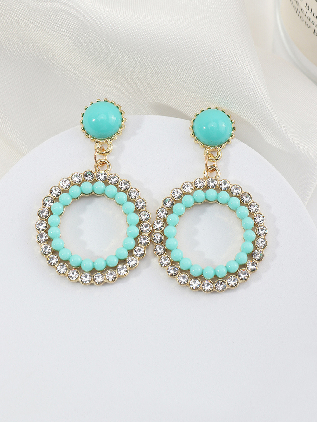 

URBANIC Turquoise Blue & Silver-Toned Circular Drop Earrings