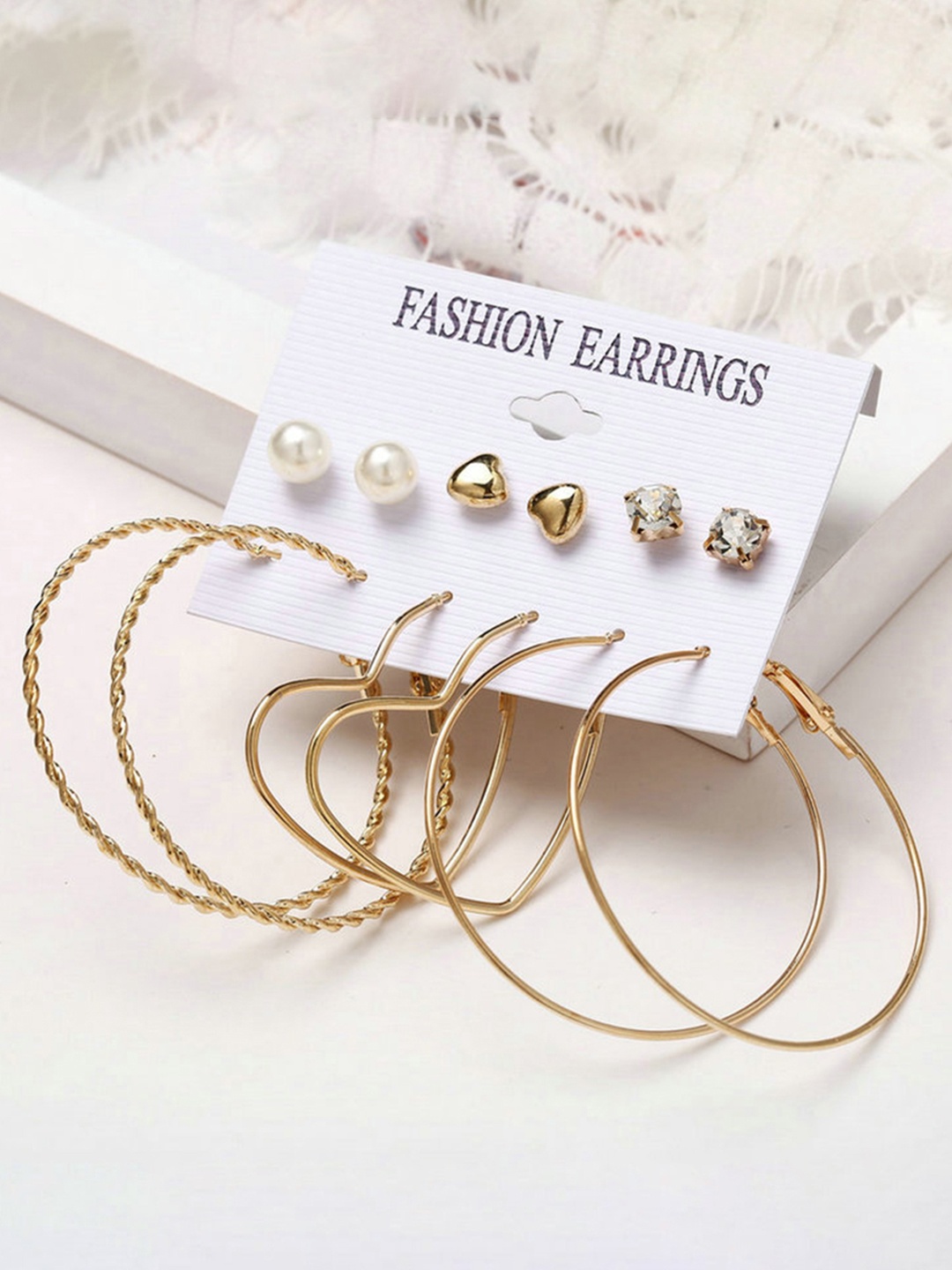 

URBANIC Gold-Toned & White Contemporary Studs Earrings
