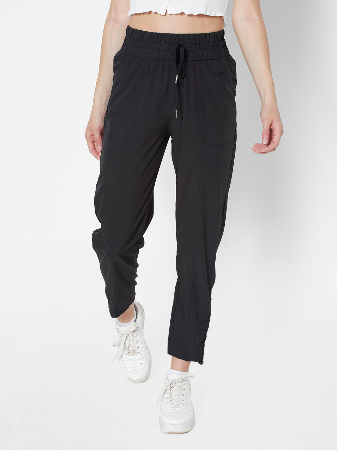 

URBANIC Women Black Solid Track Pants