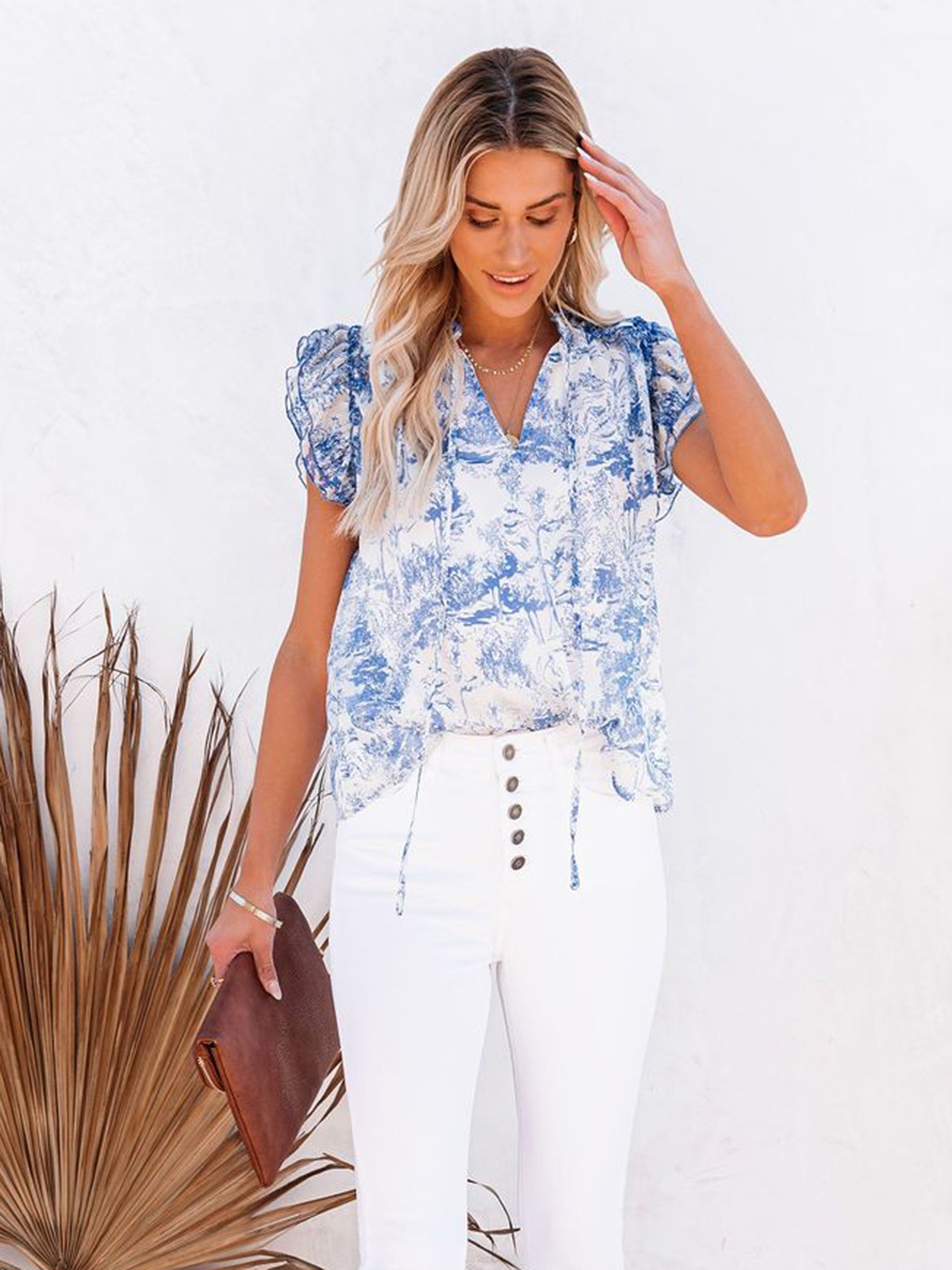 

URBANIC Women Blue & White Abstract Print Tie-Up Neck Ruffles Detail Top