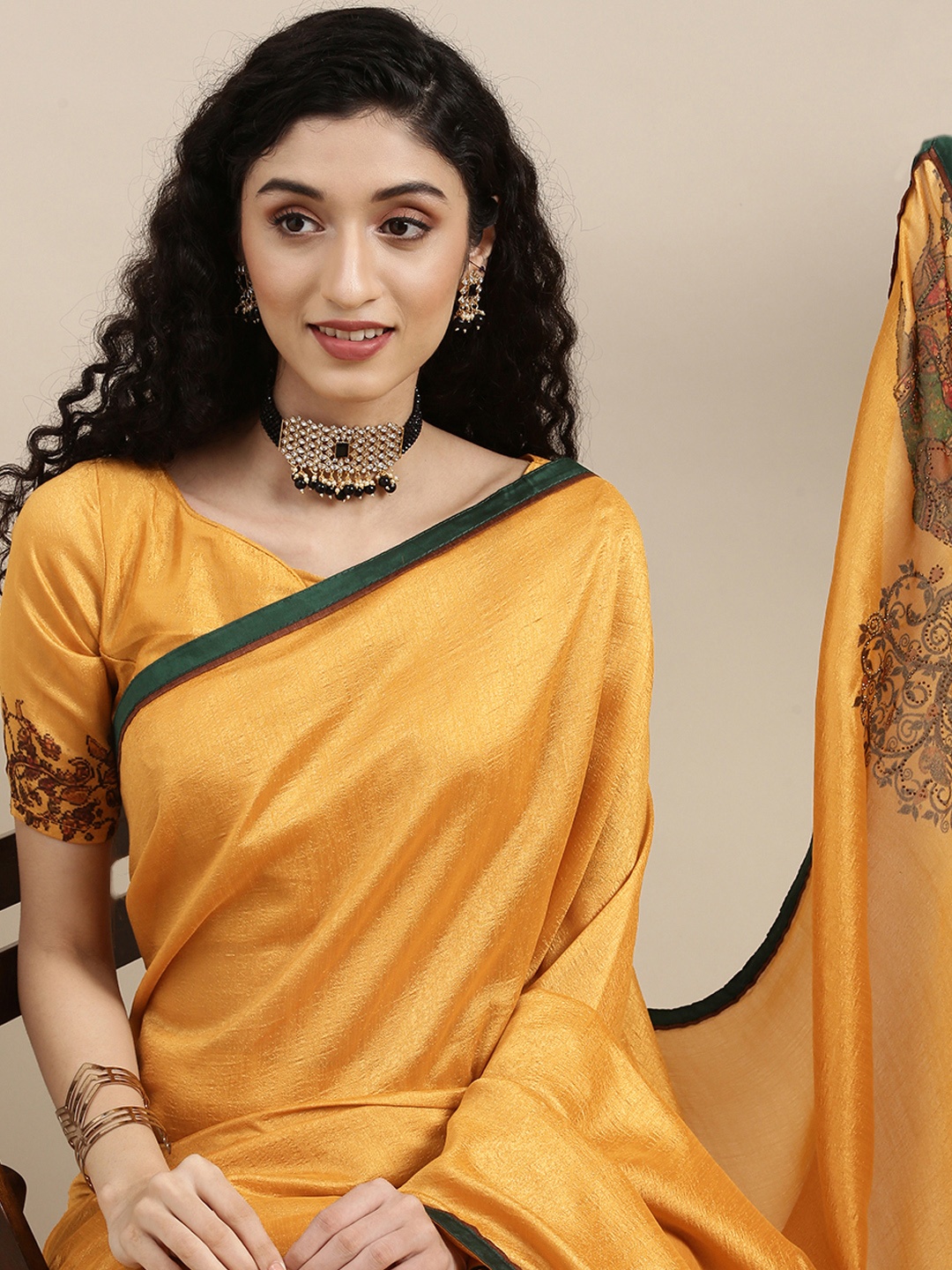 

Mitera Yellow Beads and Stones Pure Georgette Saree