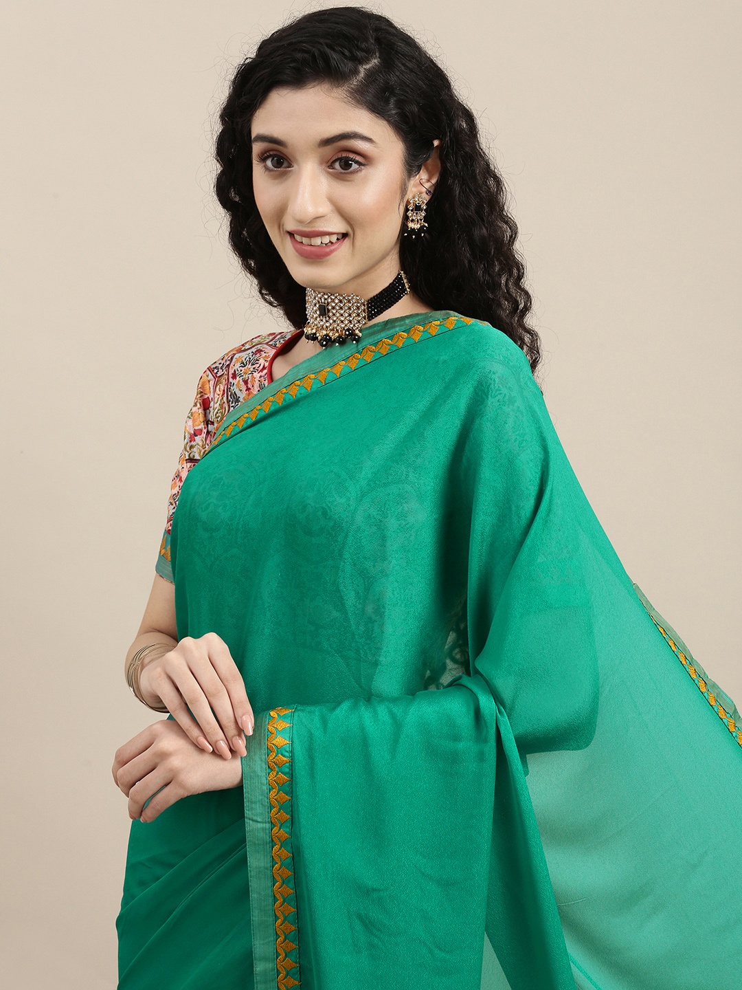 

Mitera Green Embroidered Satin Saree