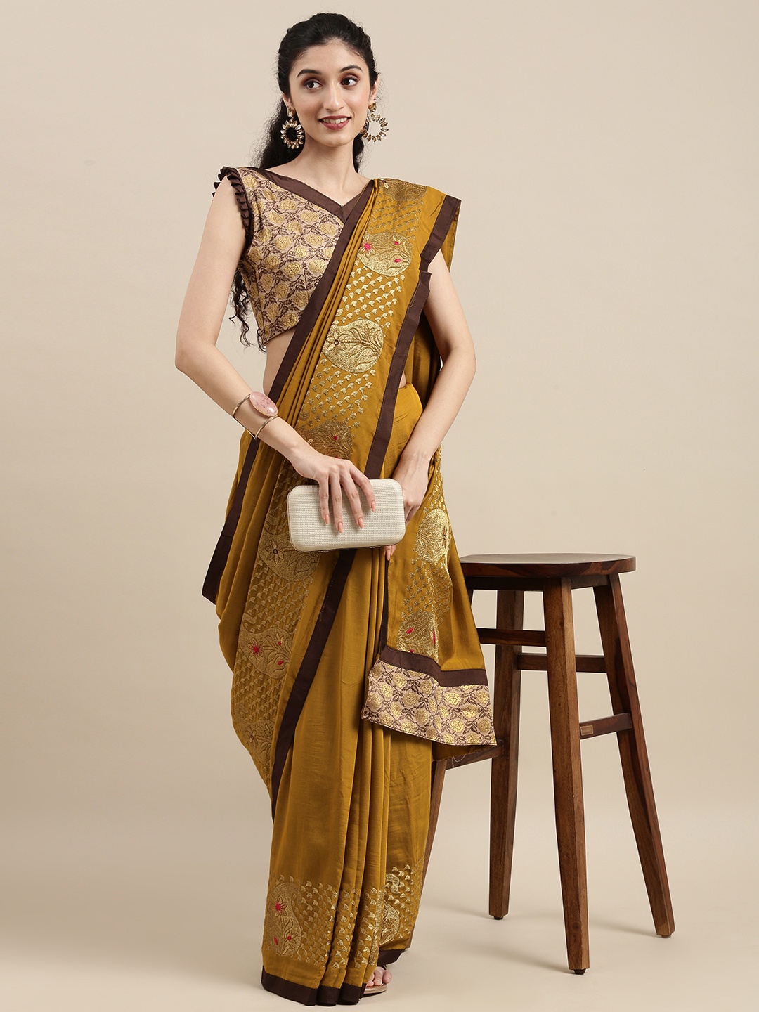 

Mitera Mustard Ethnic Motifs Embroidered Silk Blend Saree