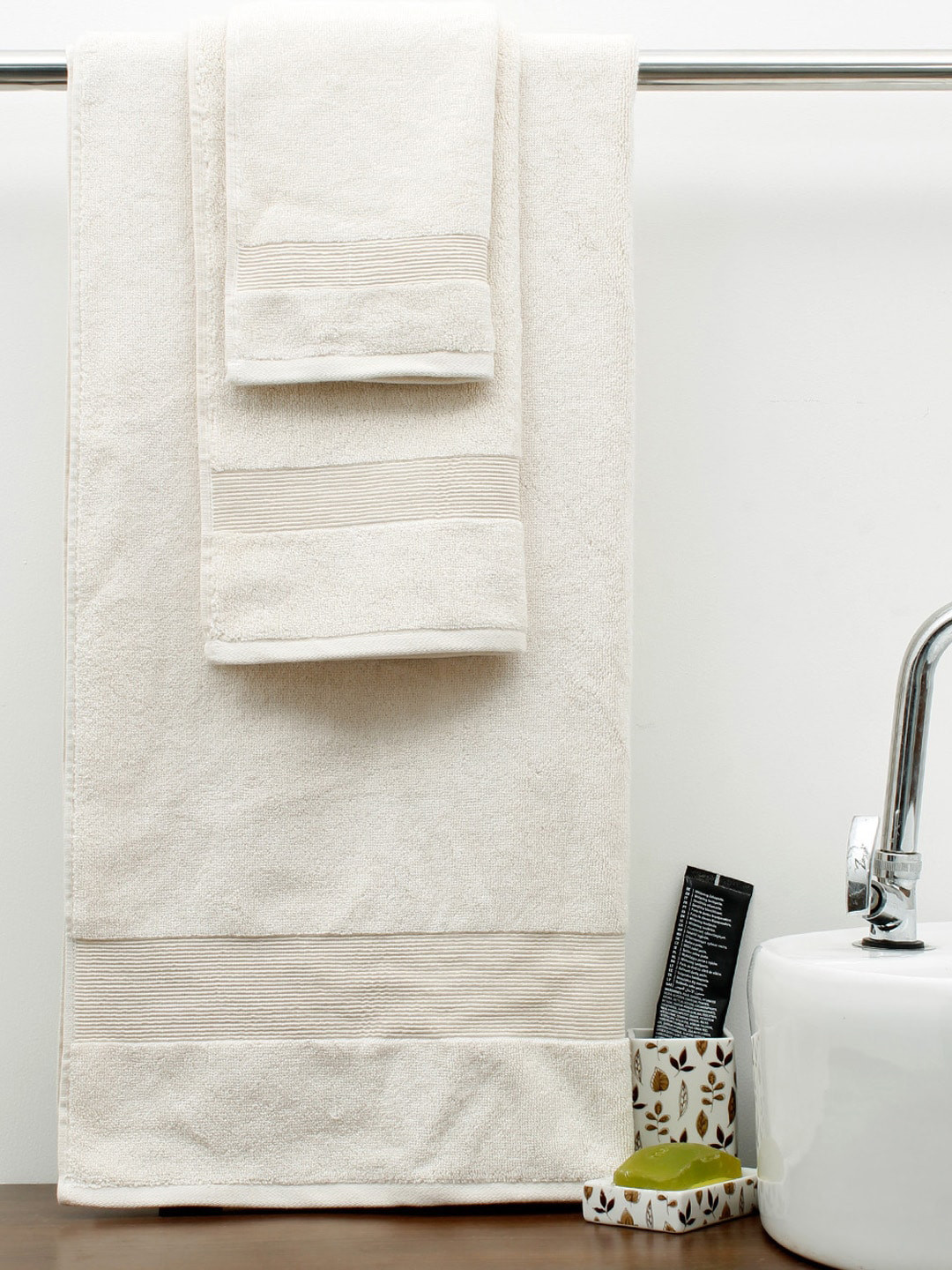 

AVI Living Set Of 4 Cream Self Design Cotton Towel Set