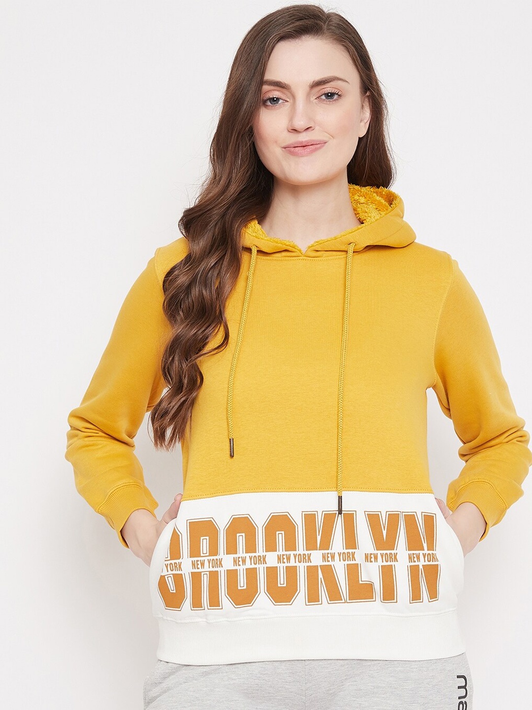 

Madame Women Mustard Printed Hooded Sweatshirt