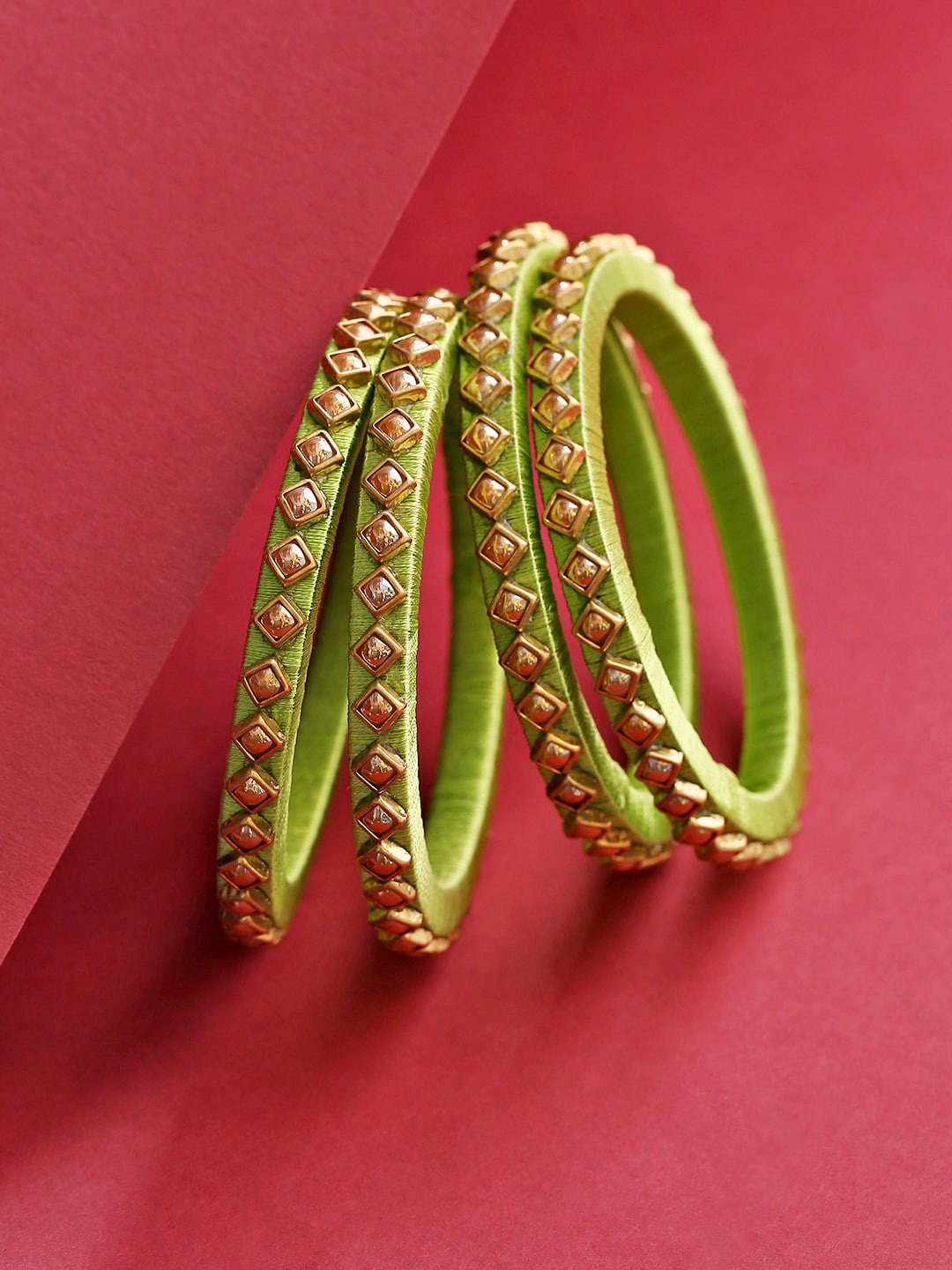 

Priyaasi Set Of 4 Gold-Toned & Green Brass Gold Plated Stone Studded Bangles