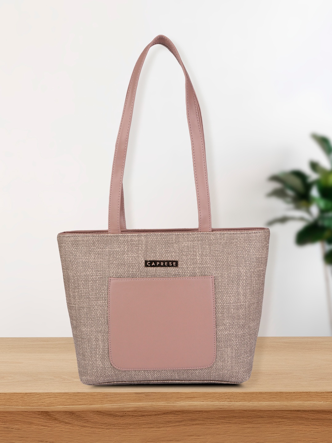 

Caprese Mauve Textured PU Structured Shoulder Bag