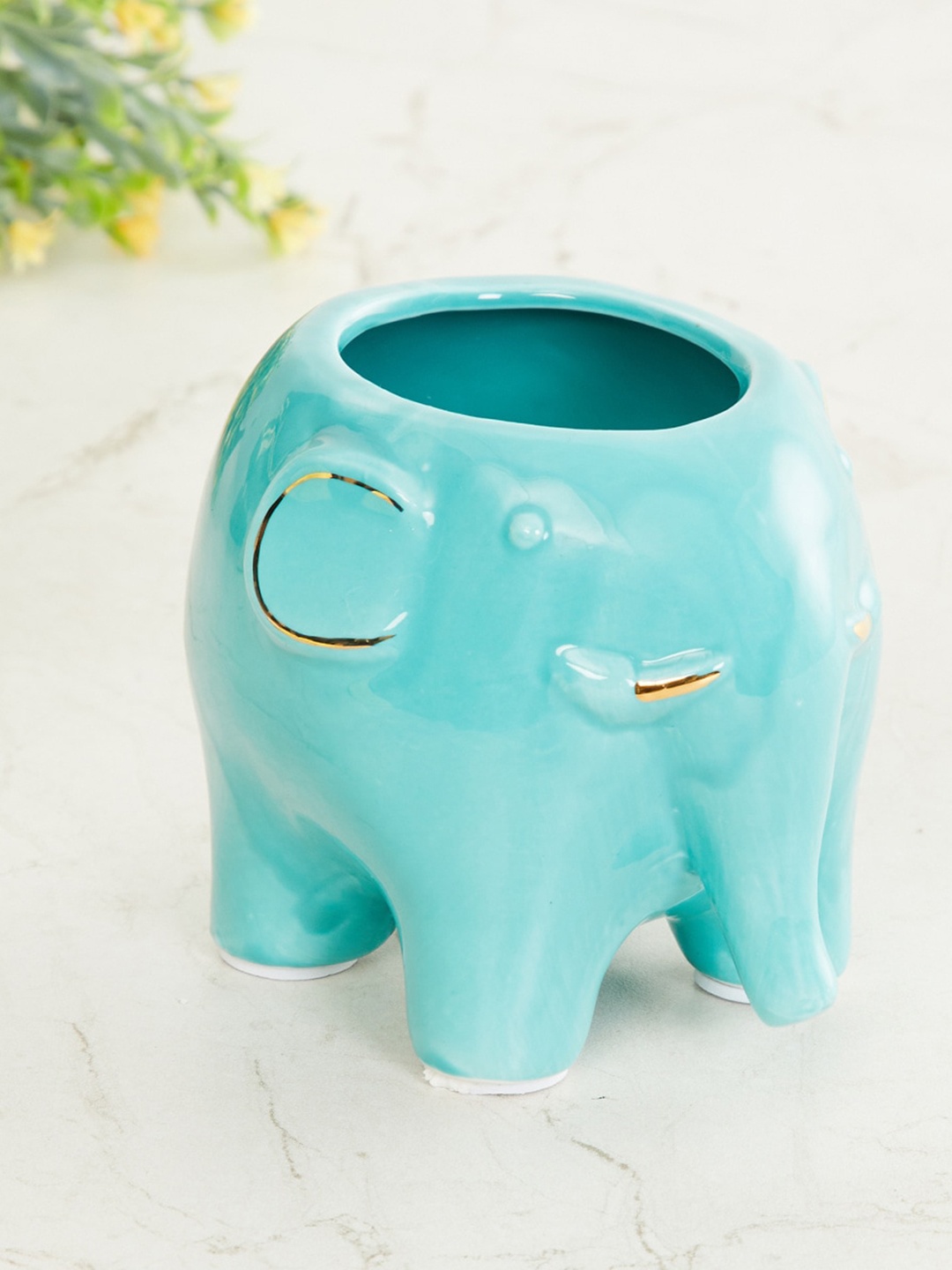 

Home Centre Teal Blue Textured Ceramic Elephant Planter