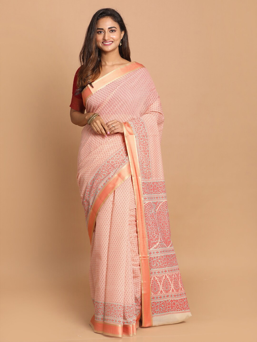 

Saranee Orange & White Ethnic Motifs Zari Saree