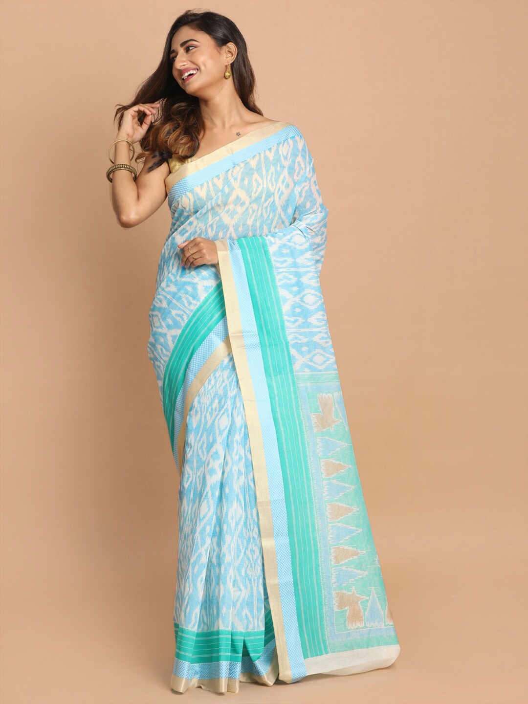 

Saranee Turquoise Blue & Cream-Coloured Ethnic Motifs Saree