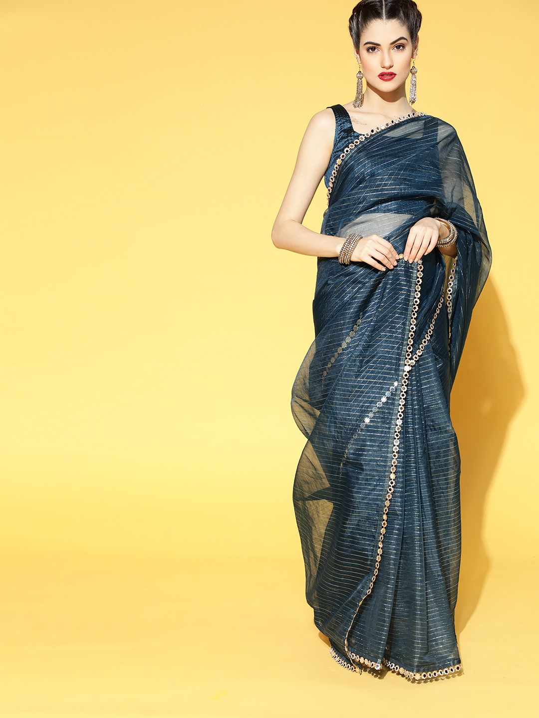 

Inddus Teal Zari Striped Organa Saree with Embellished Border & Brocade Blouse