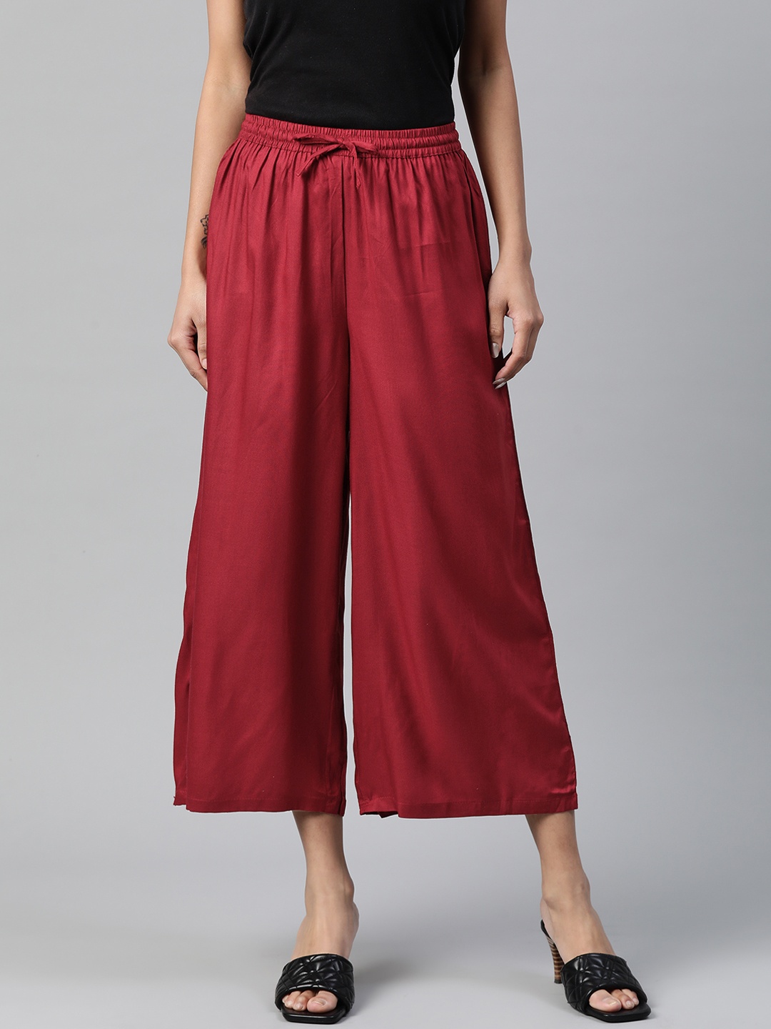 

Rangriti Women Maroon Solid Flared Leg Cropped Palazzos
