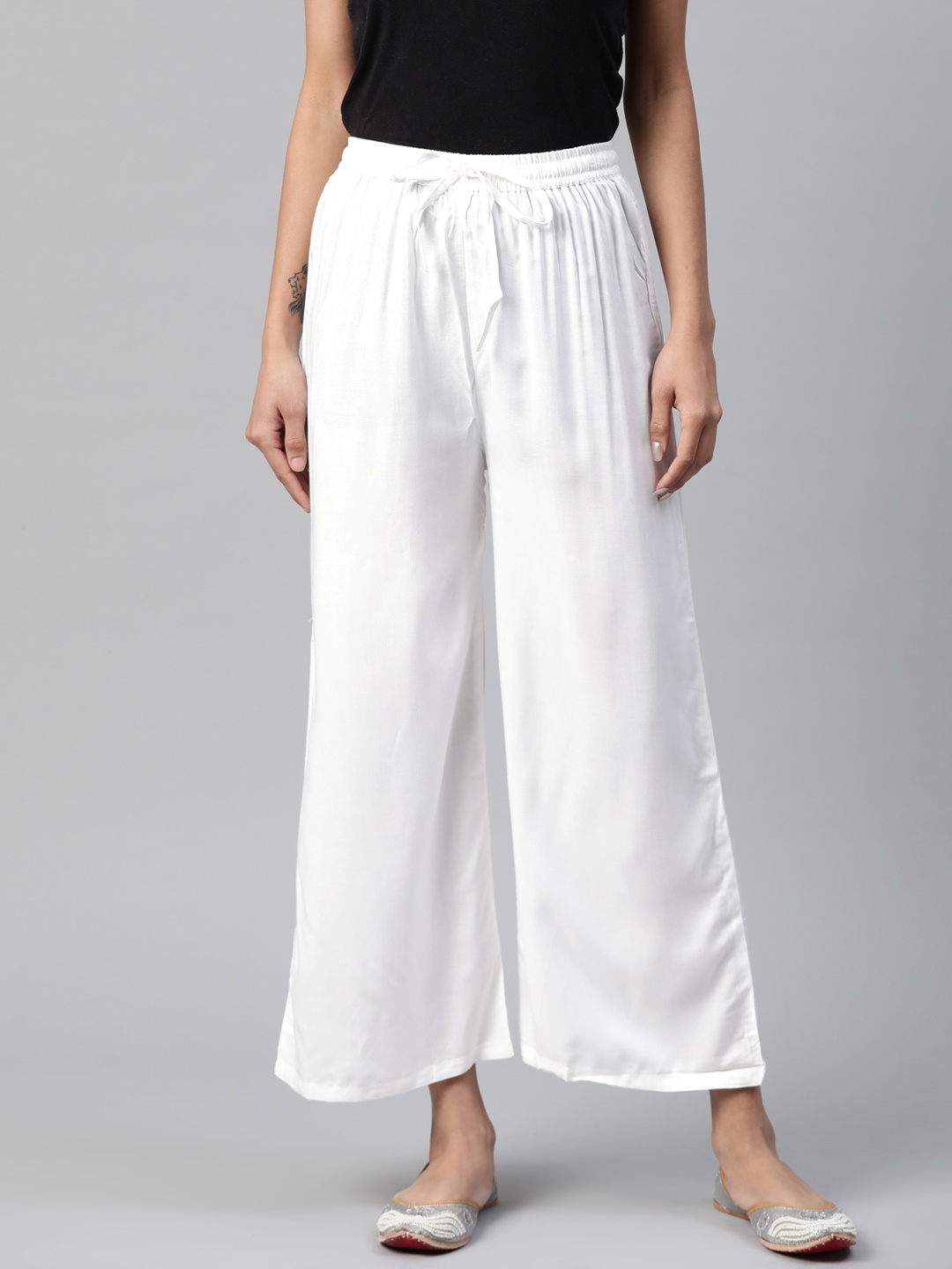 

Rangriti Women White Solid Flared Woven Palazzos